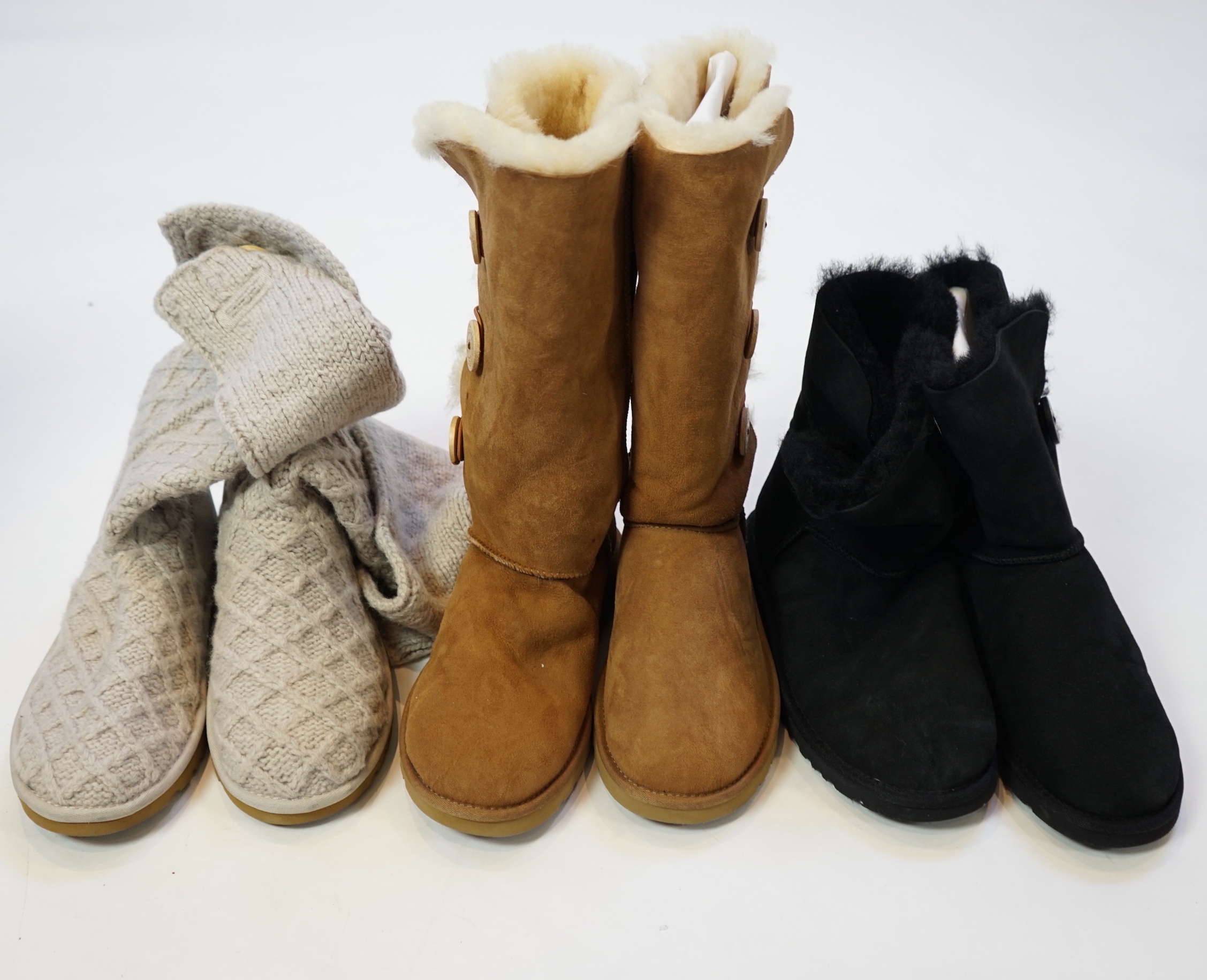 Three pairs of lady's low/mid height UGG sheepskin boots with side button design, size UK 7.5